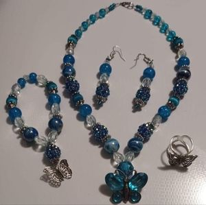 Necklace, bracelet, earrings, ring set.